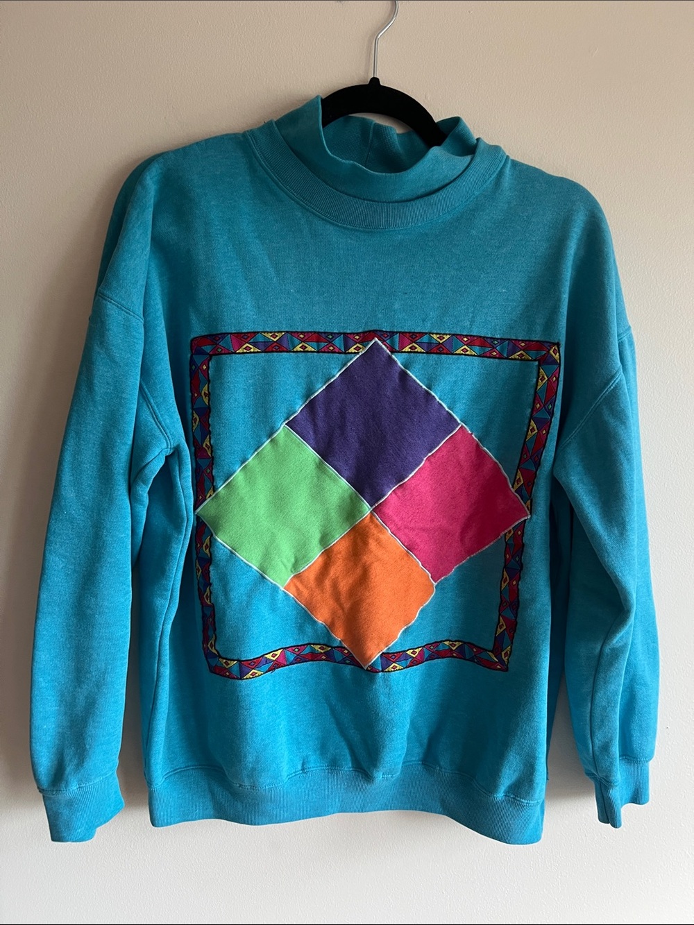 Vibrant Teal Pullover Sweatshirt with Colorblock Diamond